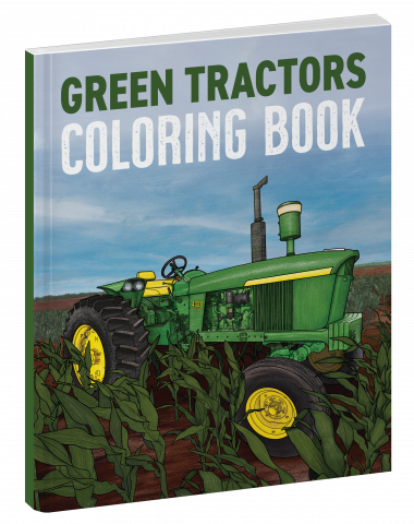 green tractor in a field with blue sky